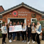 Students holding a stall to raise money for Sunbeams Charity at Rotherham Hospice